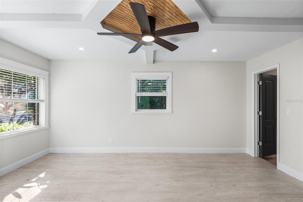 810 22nd Street North St. Petersburg, FL 33713 - Photo 11 of 37 an empty room with windows and fan