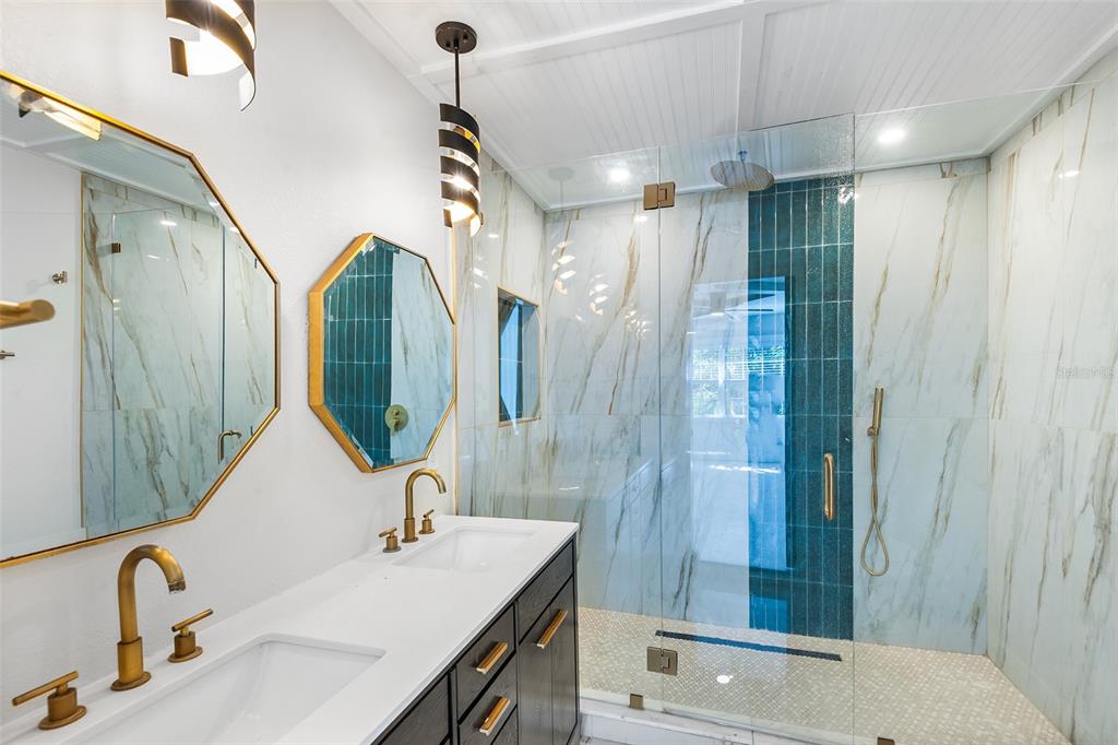 810 22nd Street North St. Petersburg, FL 33713 - Photo 15 of 37 a bathroom with a sink and a mirror