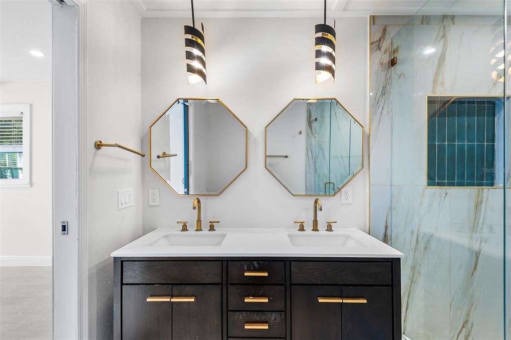 810 22nd Street North St. Petersburg, FL 33713 - Photo 16 of 37 a bathroom with a double vanity sink and a mirror