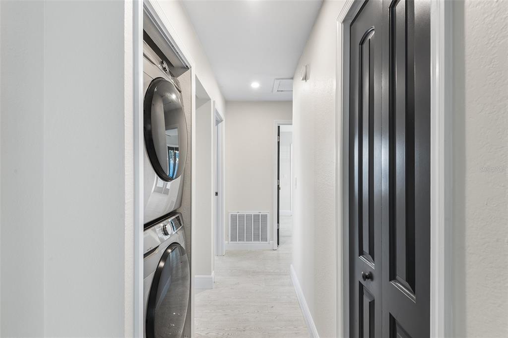 810 22nd Street North St. Petersburg, FL 33713 - Photo 17 of 37 a view of a hallway with washer and dryer