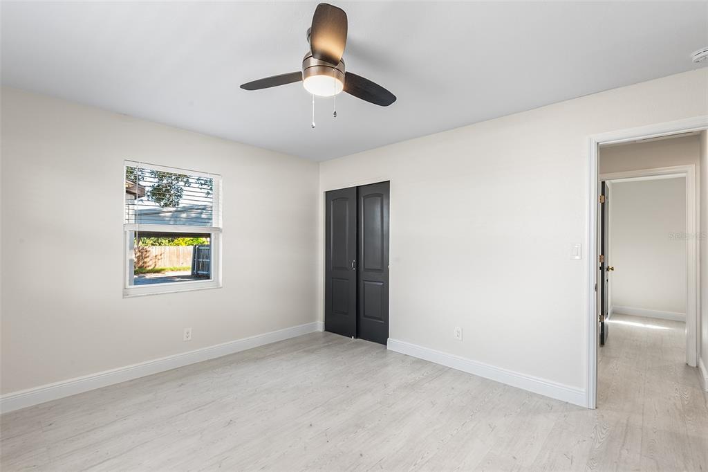 810 22nd Street North St. Petersburg, FL 33713 - Photo 19 of 37 an empty room with a window and ceiling fan