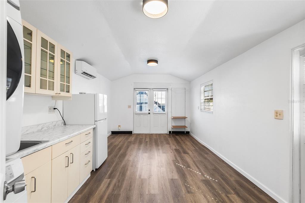 810 22nd Street North St. Petersburg, FL 33713 - Photo 25 of 37 a view of a hallway with wooden floor and a kitchen