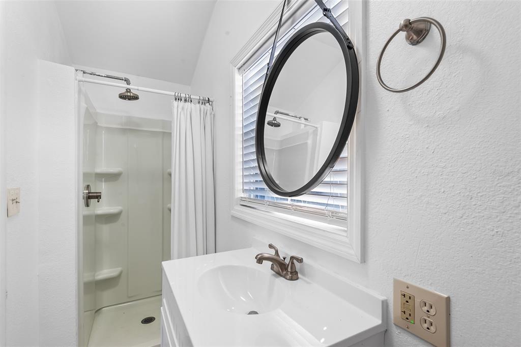 810 22nd Street North St. Petersburg, FL 33713 - Photo 30 of 37 a bathroom with a sink and a mirror