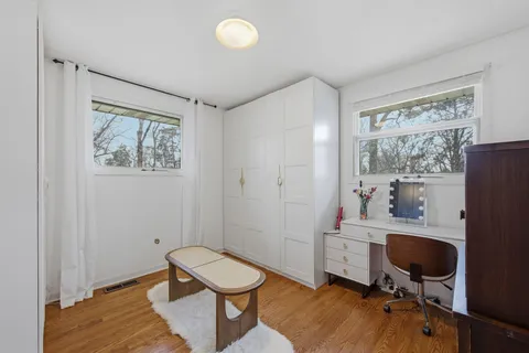 a workspace with furniture and a window