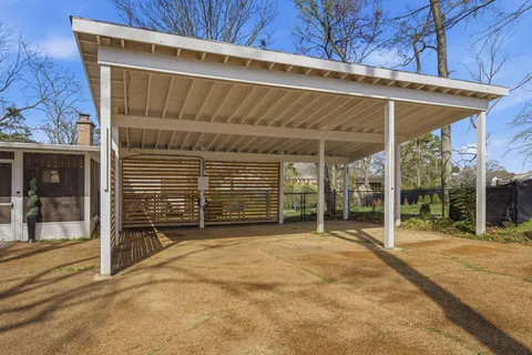 a view of a house with backyard and porch