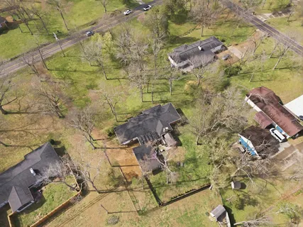 a aerial view of a yard with swimming pool