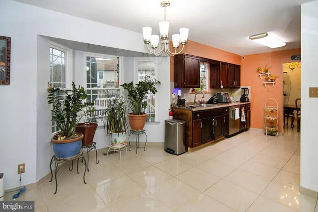 a kitchen with granite countertop a sink and a stove