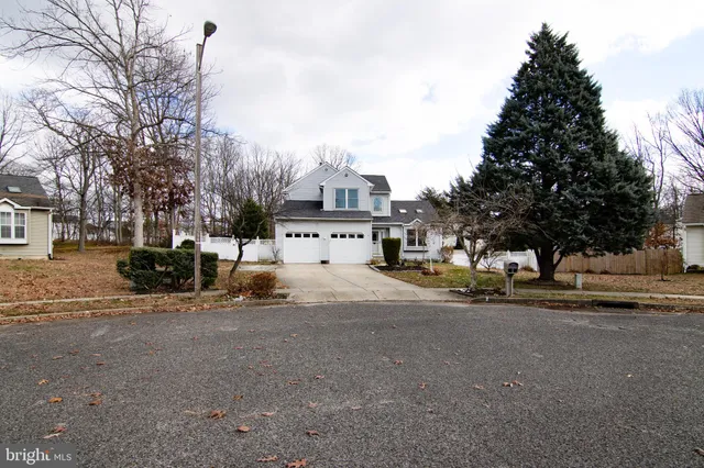 a view of street with parked cars