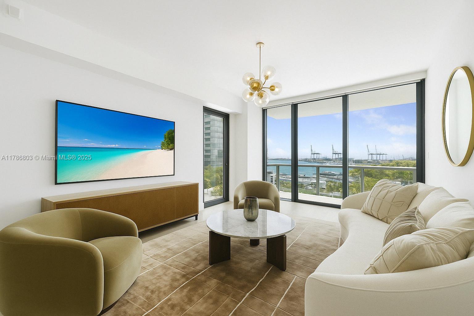 500 Alton Road, Unit 902 Miami Beach, FL 33139 - Photo 2 of 15 a living room with furniture and a large window