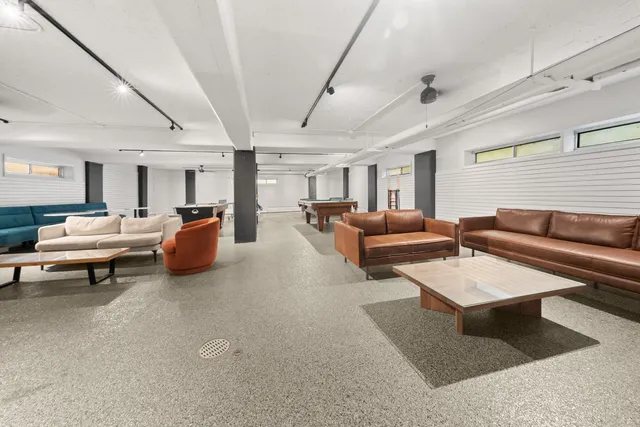 a living room with furniture and a rug