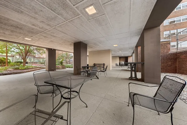 a room with lots of chairs and mirrors