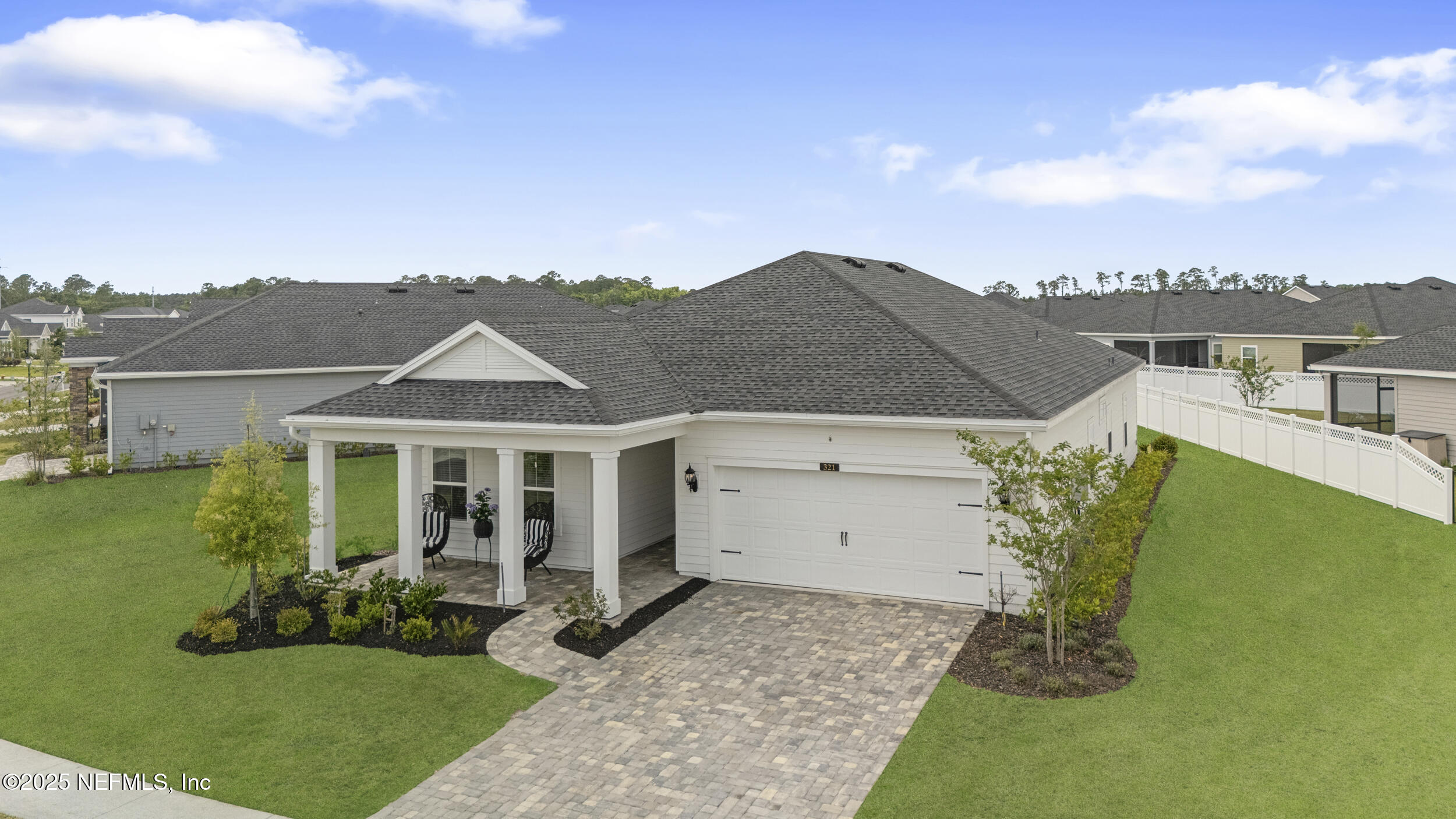a view of a house with a backyard