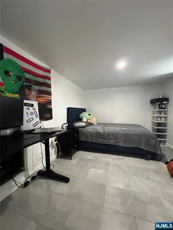 a view of a livingroom with furniture and a flat screen tv