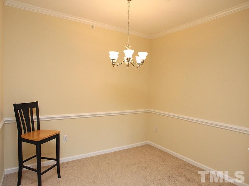 534 Weather Ridge Lane, Unit 18 Cary, NC 27513 - Photo 11 of 21 The dining room is off the kitchen and offers a beautiful chandelier.
