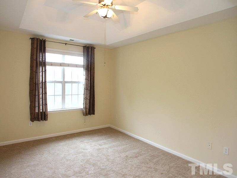 534 Weather Ridge Lane, Unit 18 Cary, NC 27513 - Photo 12 of 21 The master bedroom has a luxurious deep tray ceiling with a beautiful ceiling fan.