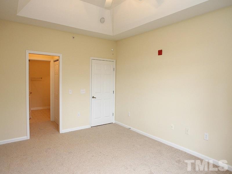 534 Weather Ridge Lane, Unit 18 Cary, NC 27513 - Photo 13 of 21 Another view of the master bedroom showing the entry to the Master bath with closets on both sides.