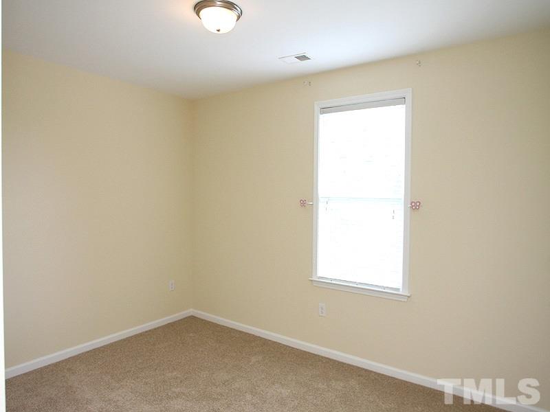 534 Weather Ridge Lane, Unit 18 Cary, NC 27513 - Photo 16 of 21 The second bedroom is spacious and comfortable.
