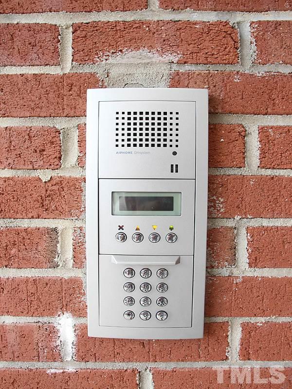The front door has a keypad and intercom for security and peace of mind