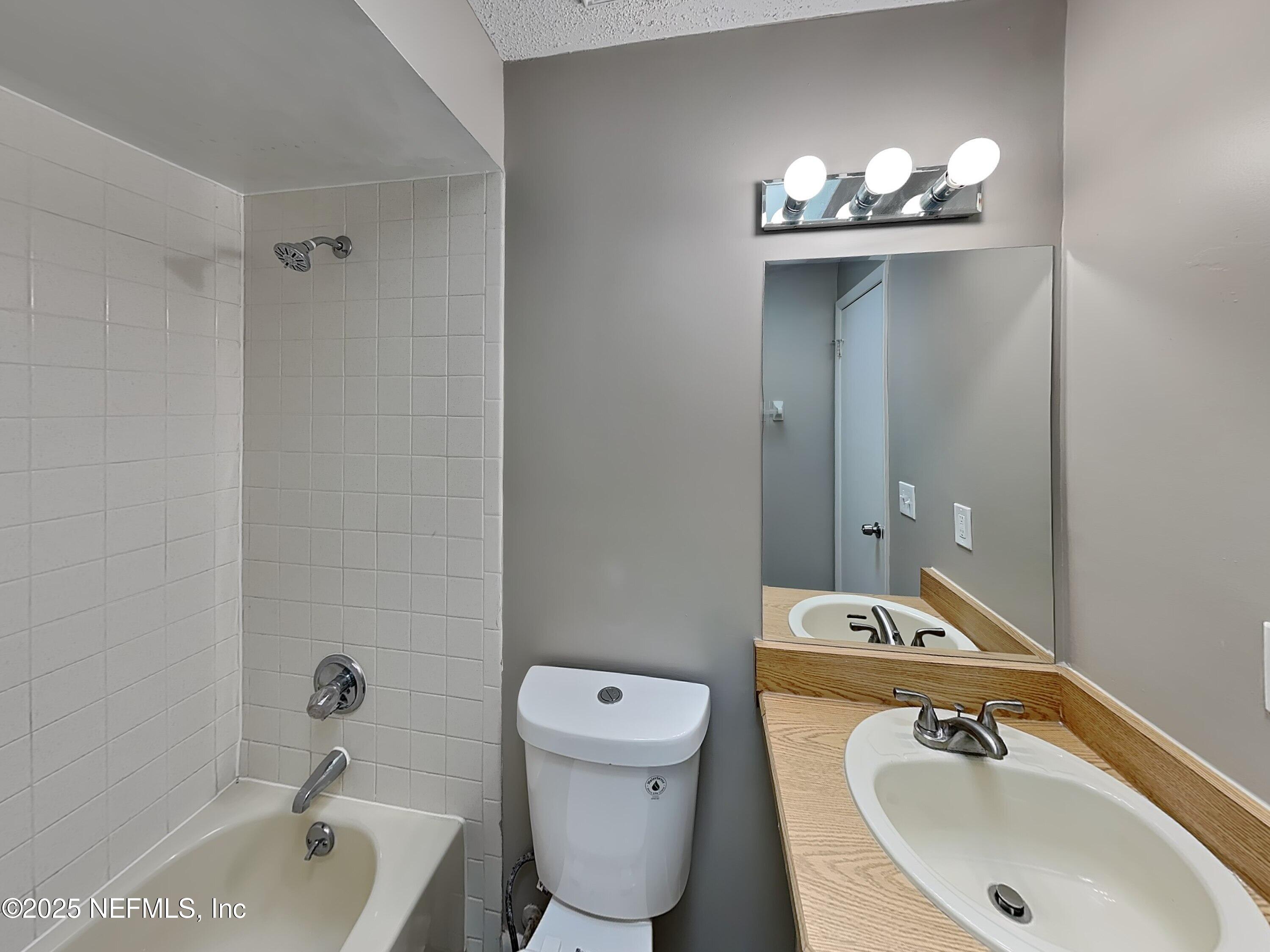 31 Folson Lane Palm Coast, FL 32137 - Photo 12 of 15 a bathroom with a sink toilet and shower