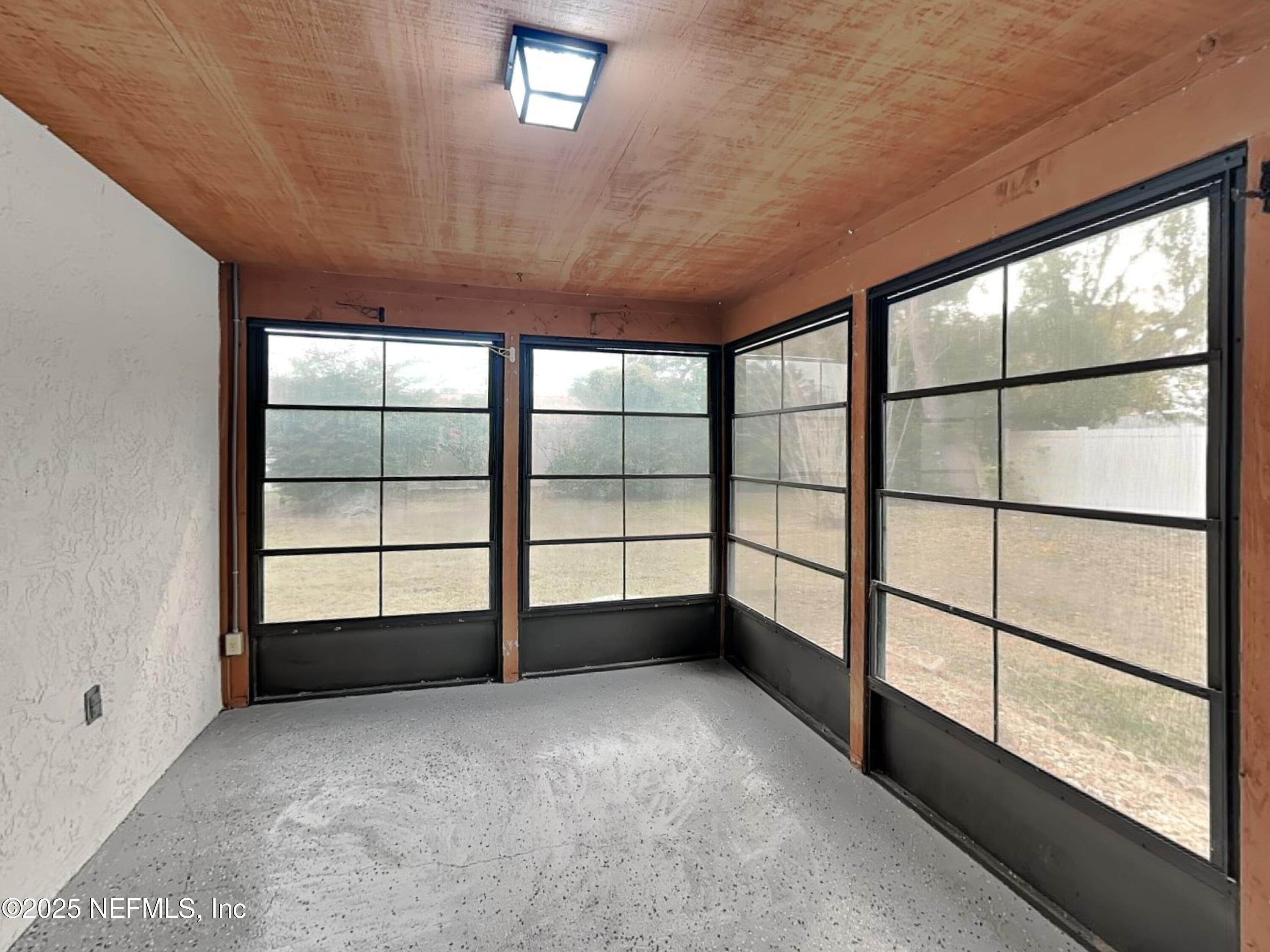 31 Folson Lane Palm Coast, FL 32137 - Photo 14 of 15 a view of empty room with windows