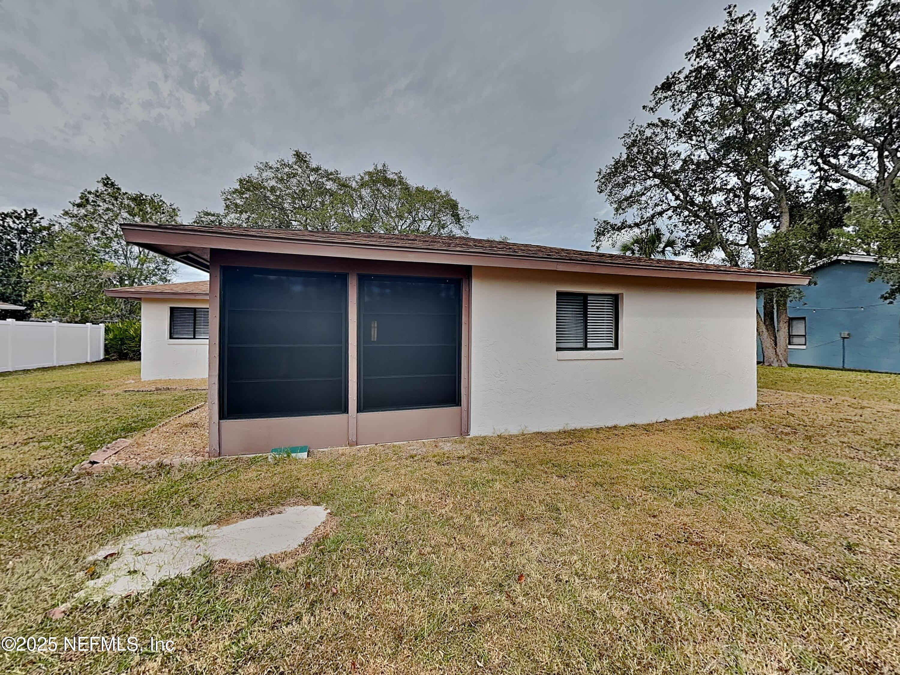 31 Folson Lane Palm Coast, FL 32137 - Photo 15 of 15 a front view of a house with a yard
