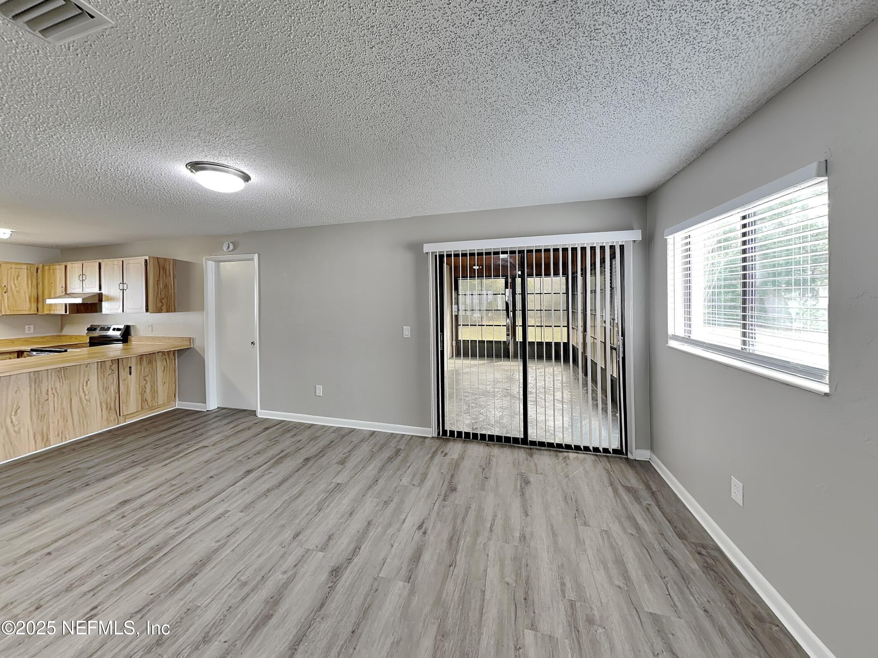 31 Folson Lane Palm Coast, FL 32137 - Photo 4 of 15 a view of a kitchen with wooden floor and a sink