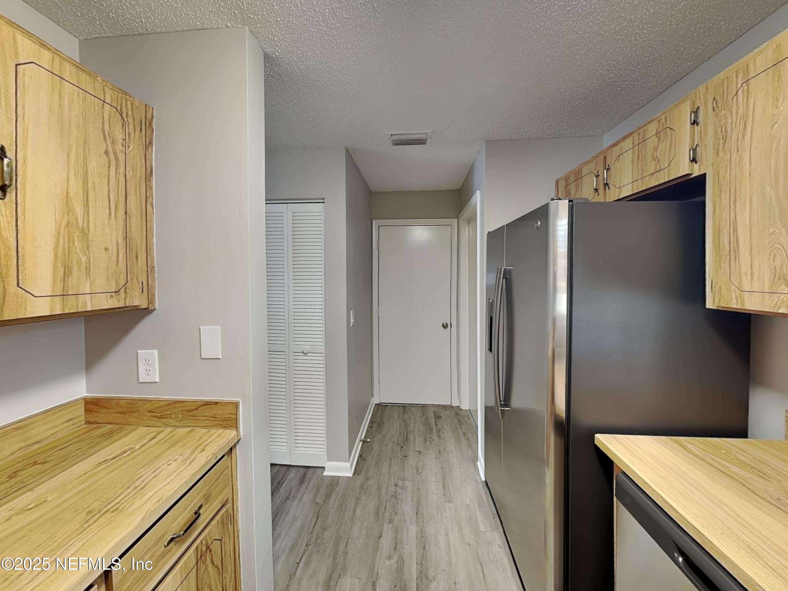 31 Folson Lane Palm Coast, FL 32137 - Photo 5 of 15 a bathroom with a granite countertop sink a shower and a bathtub