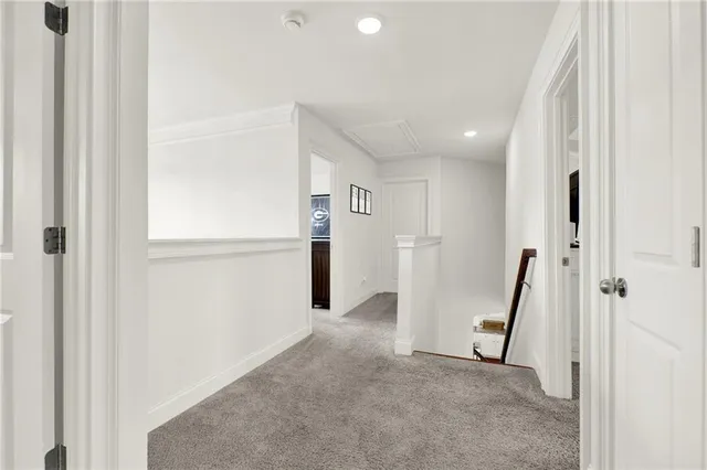 a view of a patio with table and chairs and potted plants