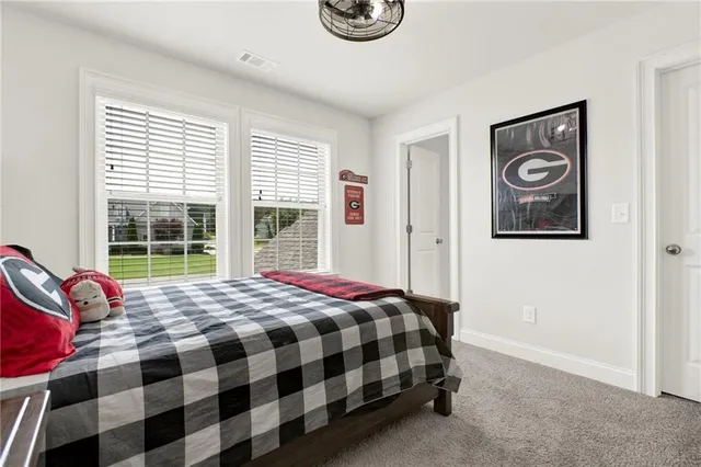 a view of a backyard with plants and a patio