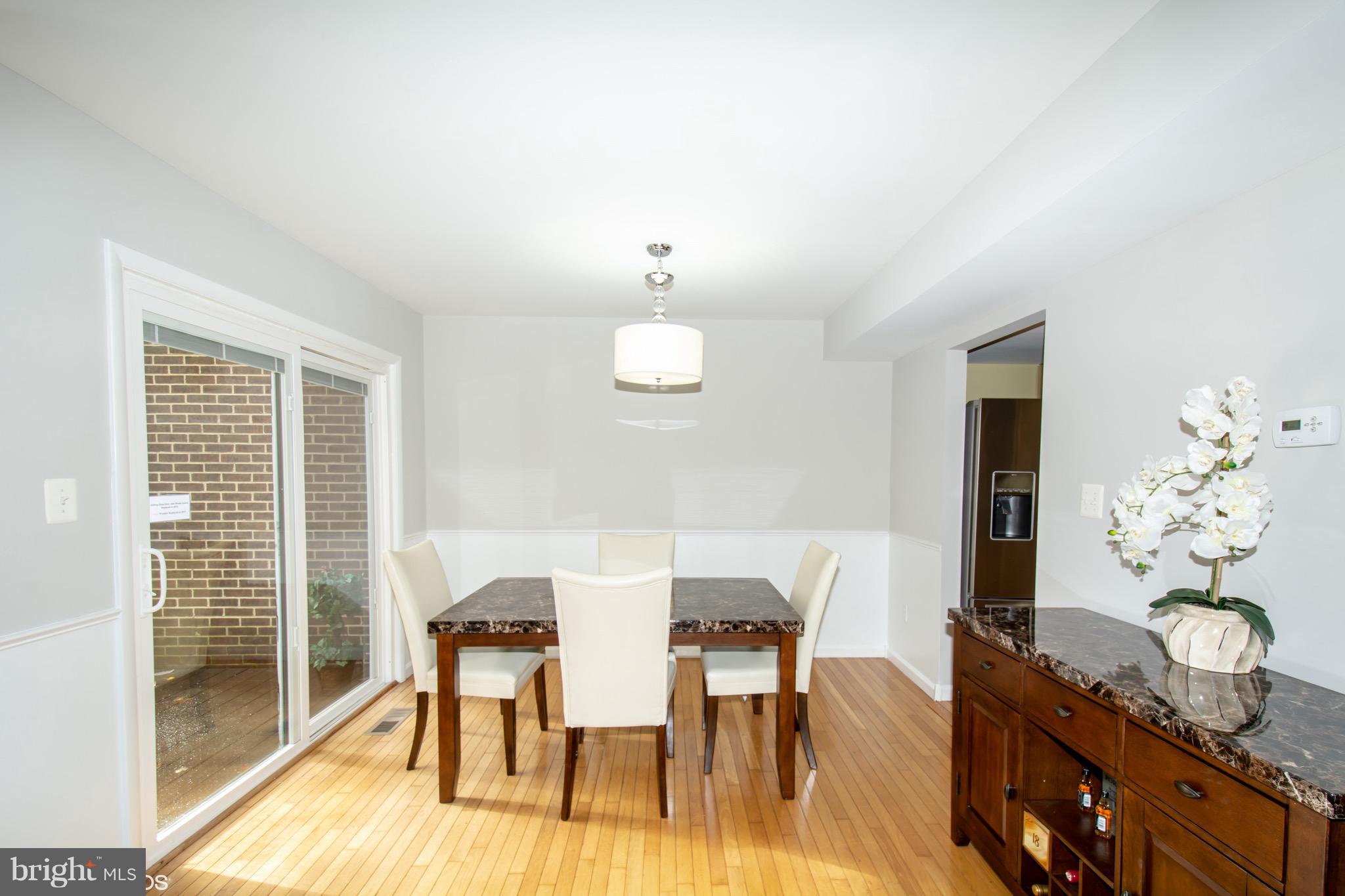 2103 Glencourse Lane Reston, VA 20191 - Photo 13 of 31 Sliding Door from Kitchen leads to large Deck.