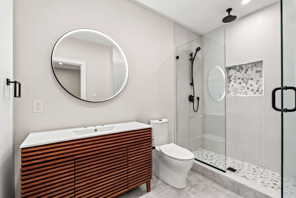 93 Sevland Road Newton, MA 02459 - Photo 31 of 34 a bathroom with a toilet a sink and a mirror
