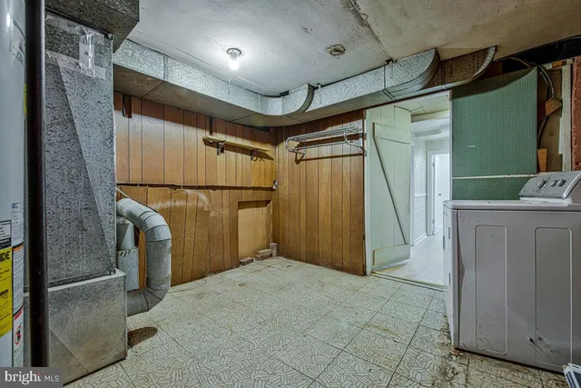 a view of storage and utility room with a sink