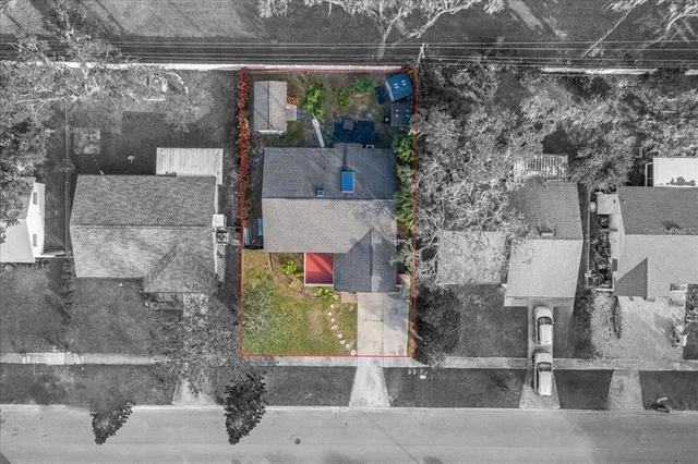 a front view of a house with swimming pool having outdoor seating