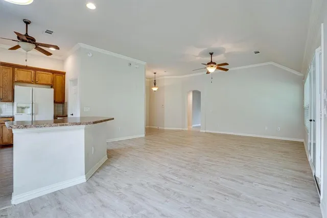 a view of a kitchen with a sink cabinet and a living room