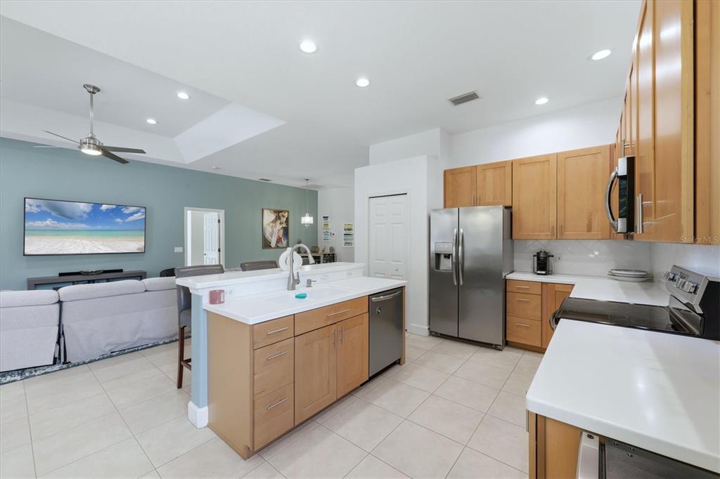 745 Fordingbridge Way Osprey, FL 34229 - Photo 12 of 53 a kitchen that has a lot of cabinets in it and stainless steel appliances