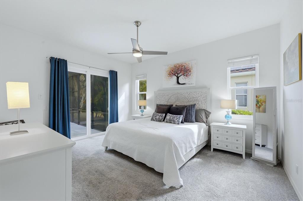 745 Fordingbridge Way Osprey, FL 34229 - Photo 16 of 53 a bedroom with a bed and a chandelier