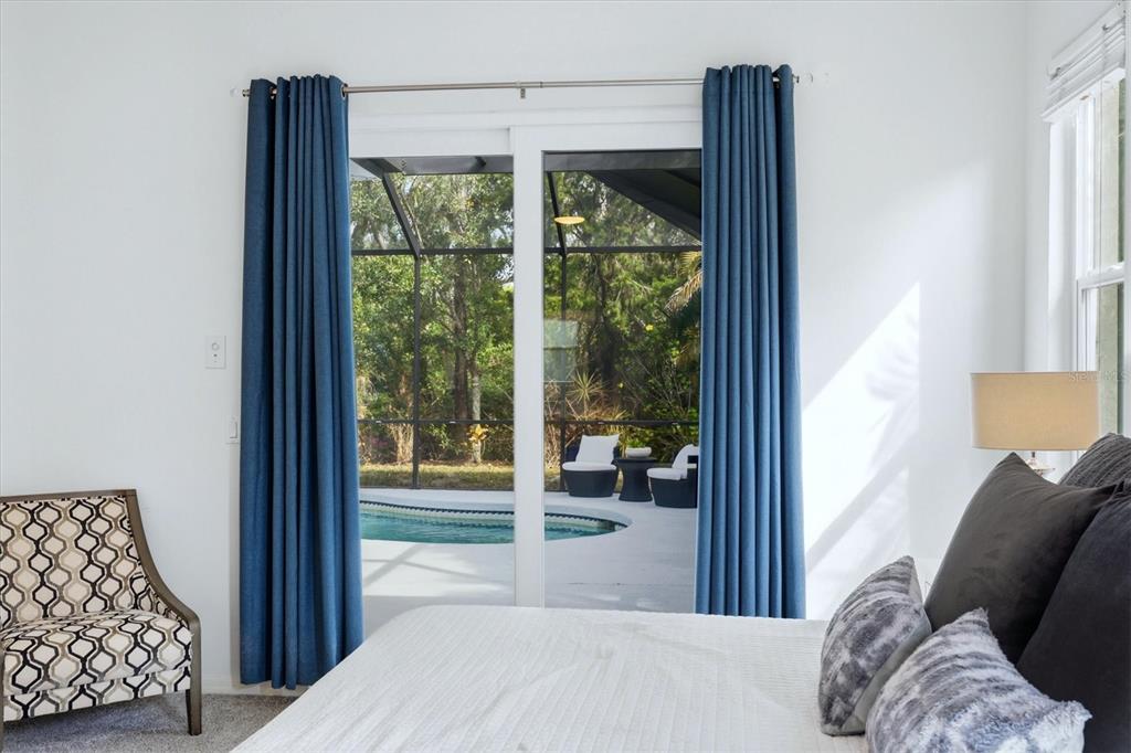 745 Fordingbridge Way Osprey, FL 34229 - Photo 19 of 53 a bedroom with furniture and large window