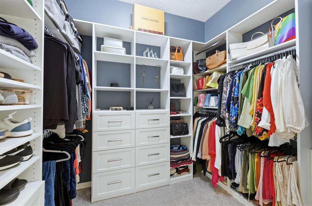 745 Fordingbridge Way Osprey, FL 34229 - Photo 20 of 53 a view of walk in closet with clothes and shoes