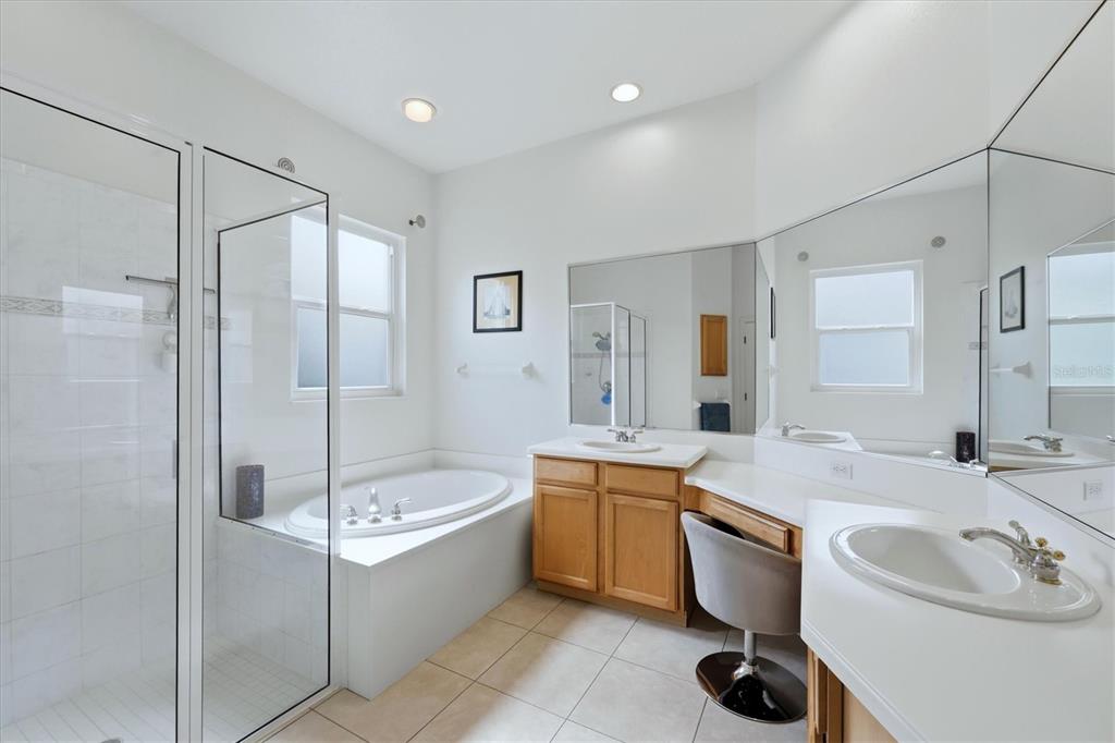 745 Fordingbridge Way Osprey, FL 34229 - Photo 21 of 53 a bathroom with a tub sink and mirror
