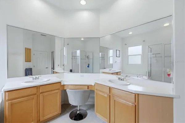 a bathroom with a sink double vanity and a mirror