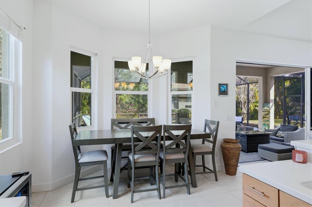 745 Fordingbridge Way Osprey, FL 34229 - Photo 9 of 53 a view of a dining room with furniture window and outside view