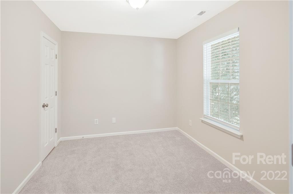 236 Pangle Drive Charlotte, NC 28217 - Photo 19 of 26 a view of an empty room with a window