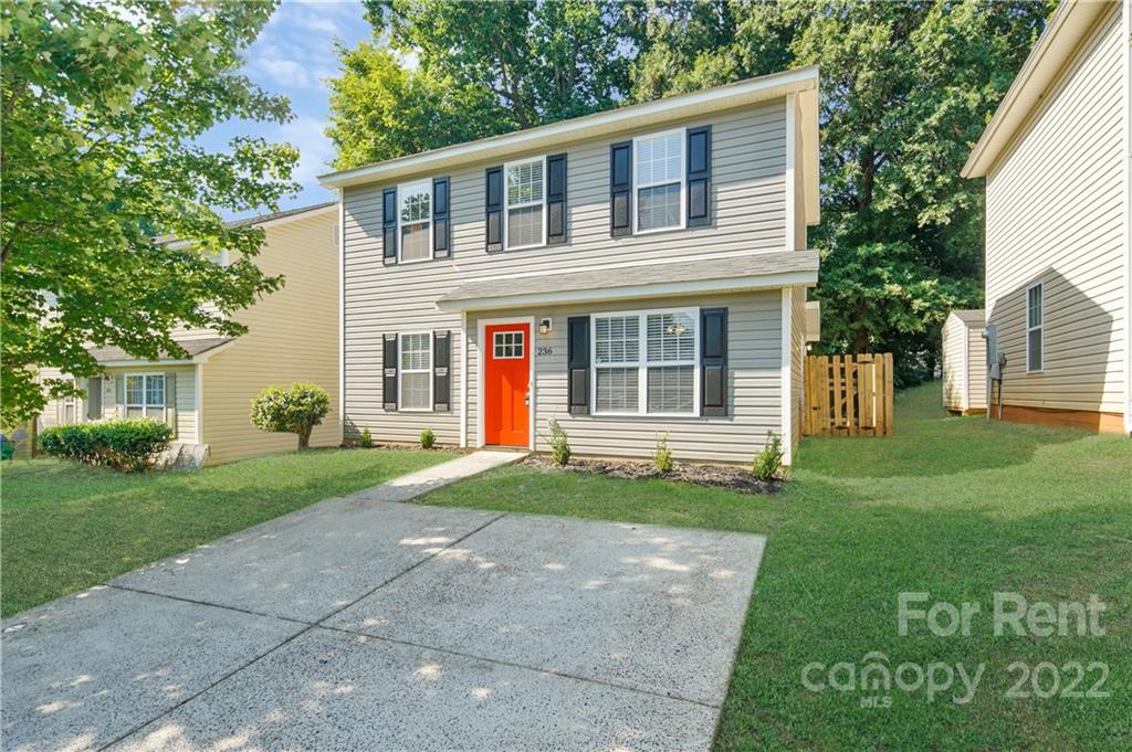 236 Pangle Drive Charlotte, NC 28217 - Photo 2 of 26 a front view of a house with a yard