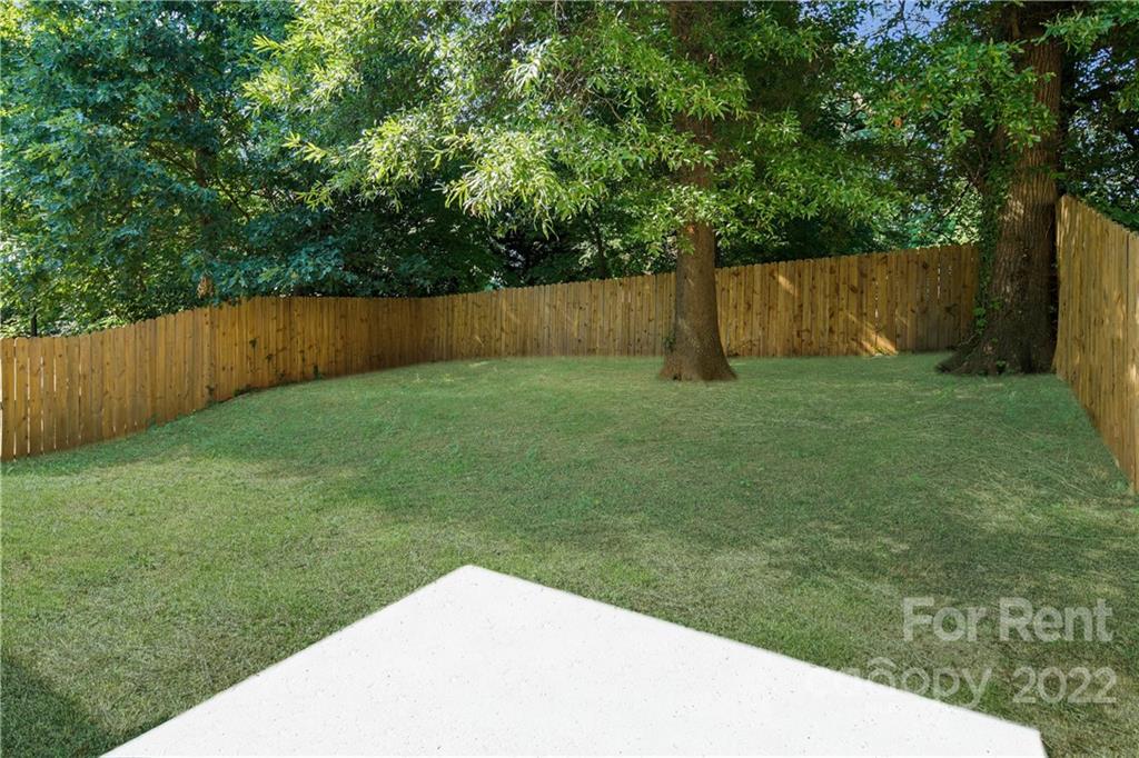 236 Pangle Drive Charlotte, NC 28217 - Photo 25 of 26 a view of a backyard with a tree