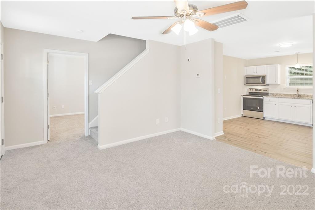 236 Pangle Drive Charlotte, NC 28217 - Photo 6 of 26 a view of a kitchen with a sink and a refrigerator