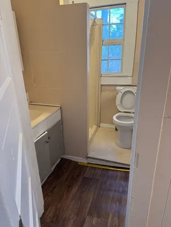 a bathroom with a sink and toilet