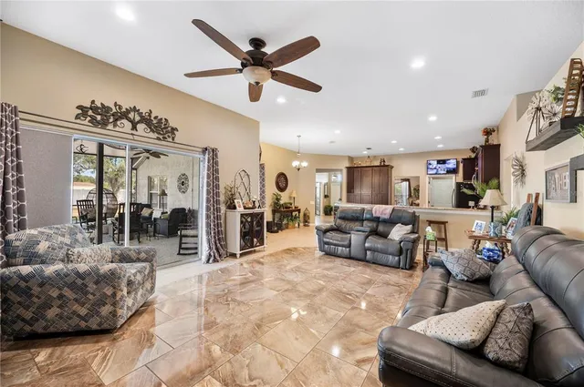 a spacious bathroom with a granite countertop double vanity sink a mirror and a shower