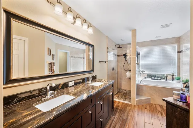 a bedroom with a bed and chair