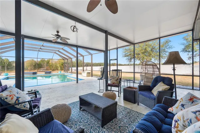 a view of a swimming pool with a patio