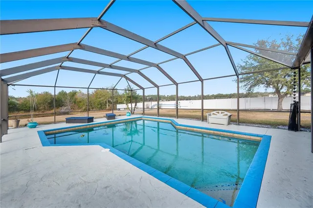 a view of swimming pool with yard